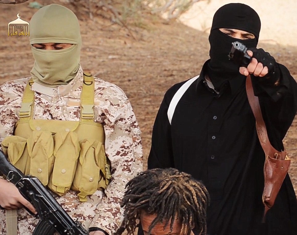 A masked fighter in black (right) brandishing a pistol vows to kill Christians if they do not convert, saying: 'Muslim blood shed under the hands of your religions is not cheap. To the nation of the cross we are now back again'